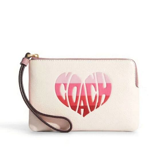 COACH CORNER ZIP WRISTLET WITH STRIPE HEART MOTIF IN GOLD / PINK / CHALK MULT - Picture 1 of 2